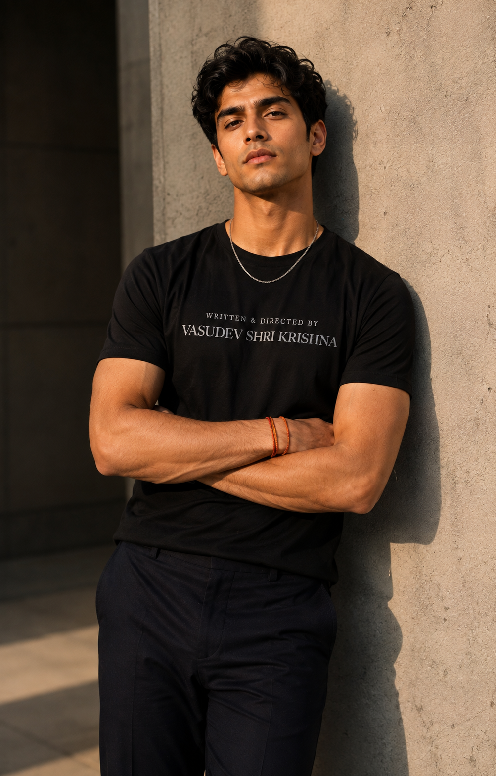 Male model wearing Written and Directed By Krishna black tee