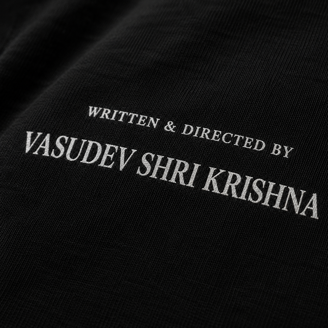 Close-up of Written and Directed By text print on cotton